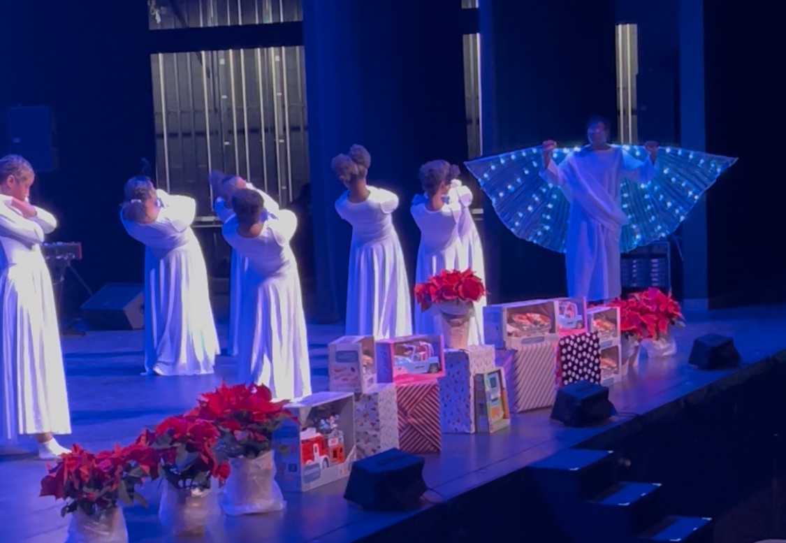 Dancers performing together on stage